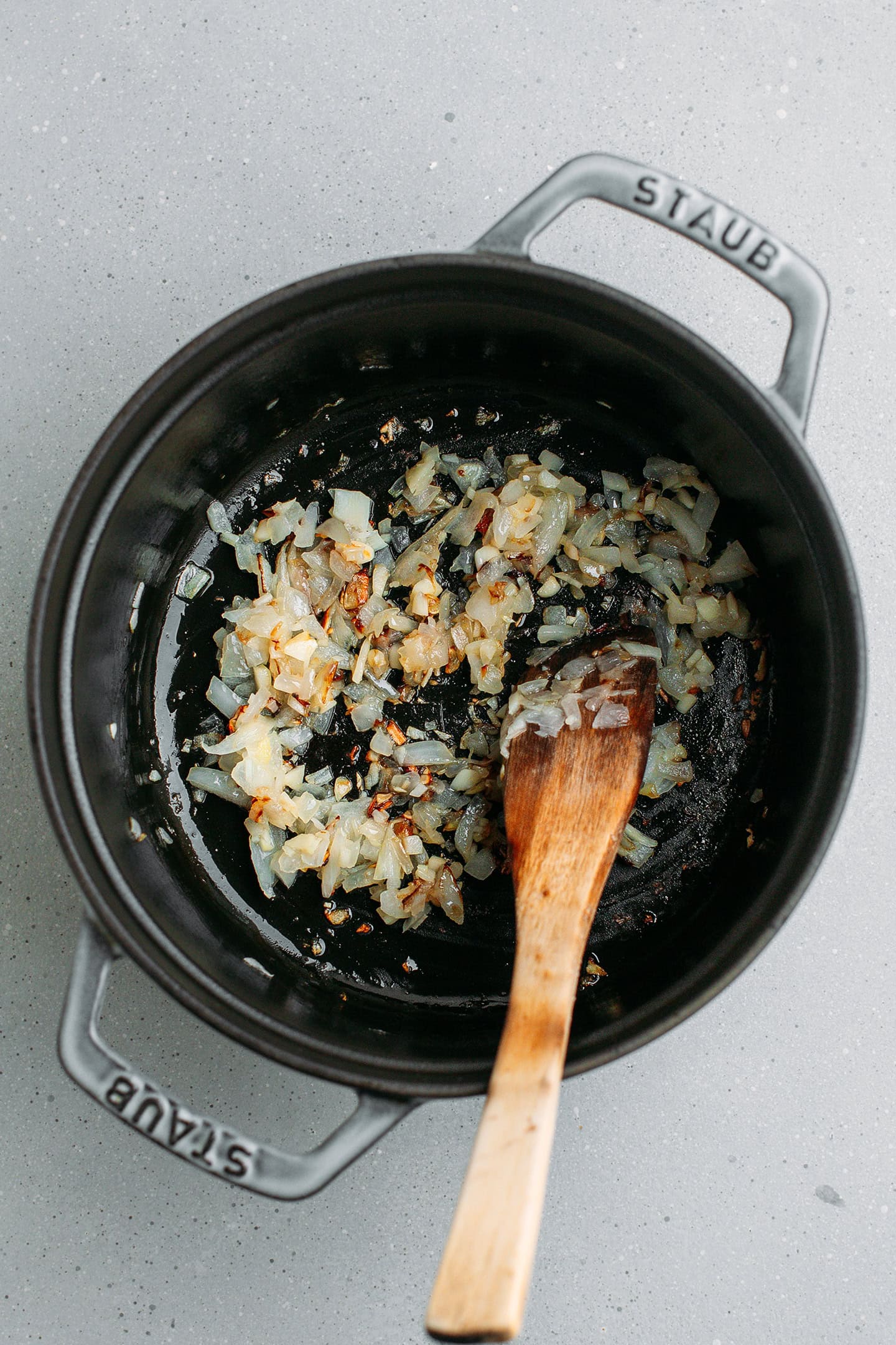 Sautéed garlic and onion in a pot.