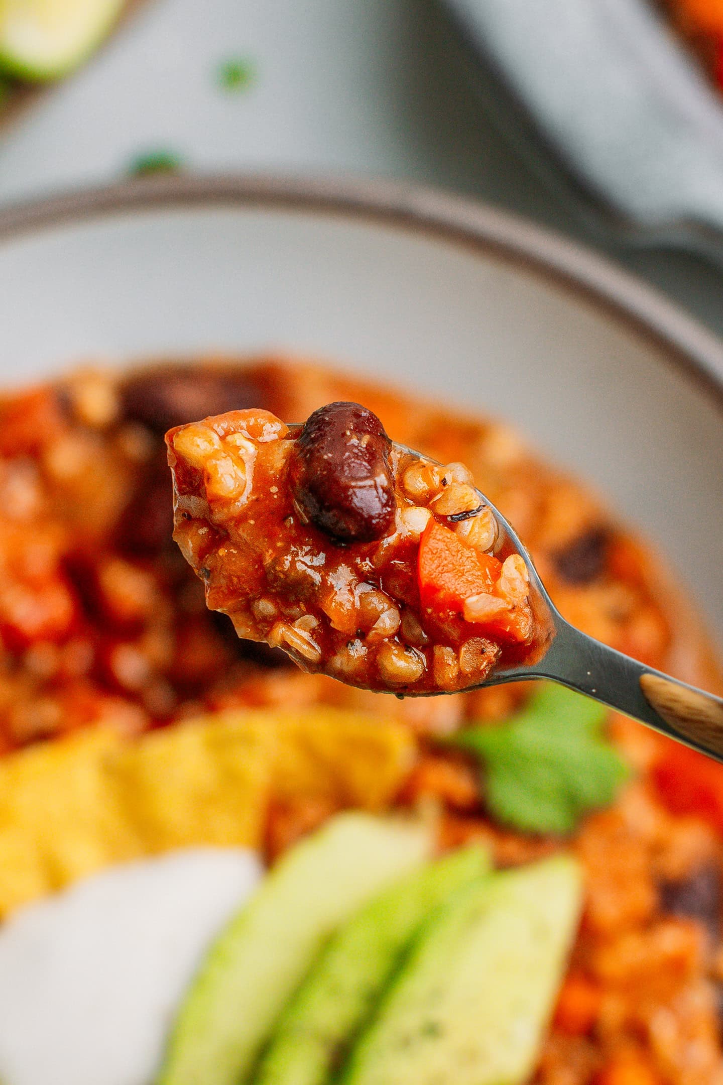 Close-up of a spoonful of buckwheat groats chili.