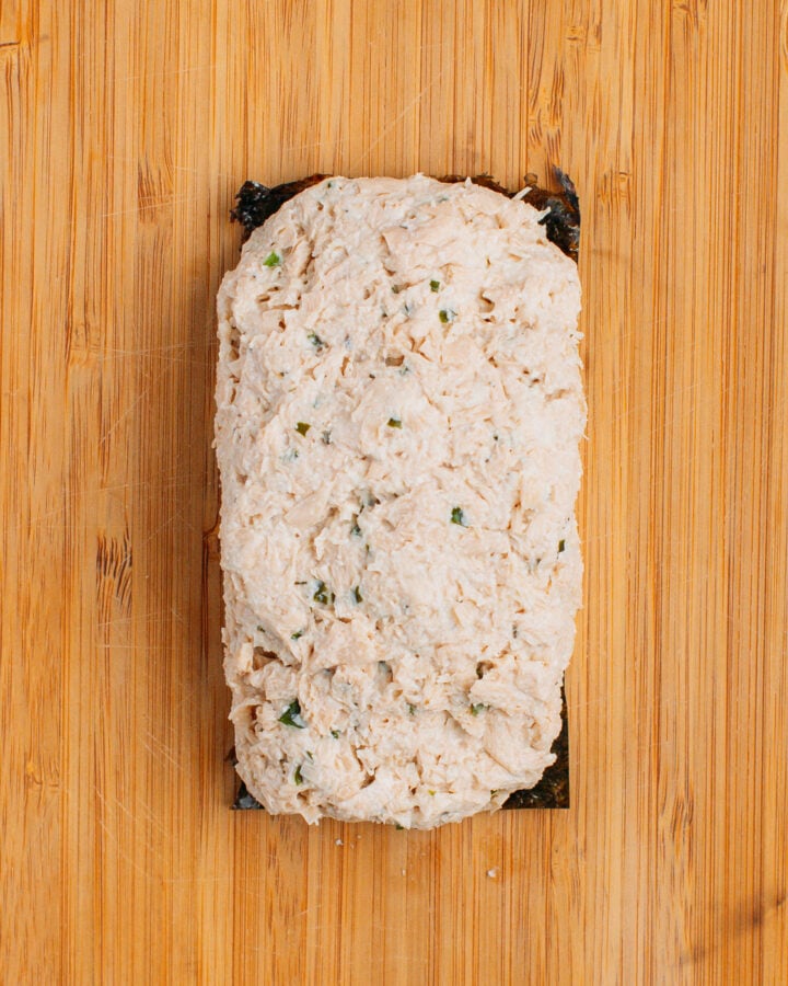 Sheet of nori topped with a mixture of tofu and TVP.
