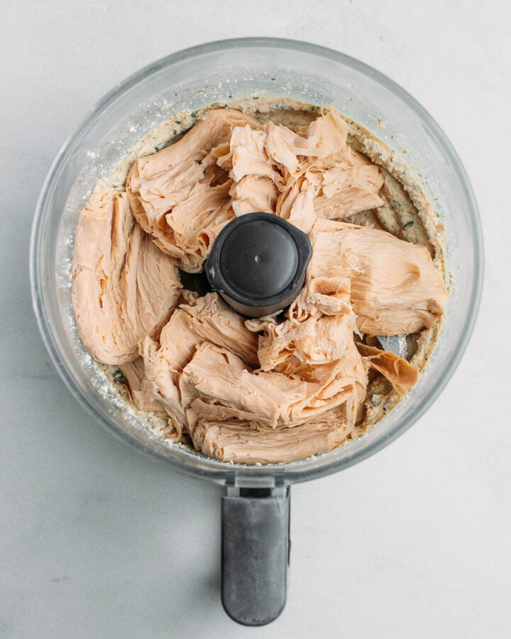 TVP slices and tofu in a food processor.