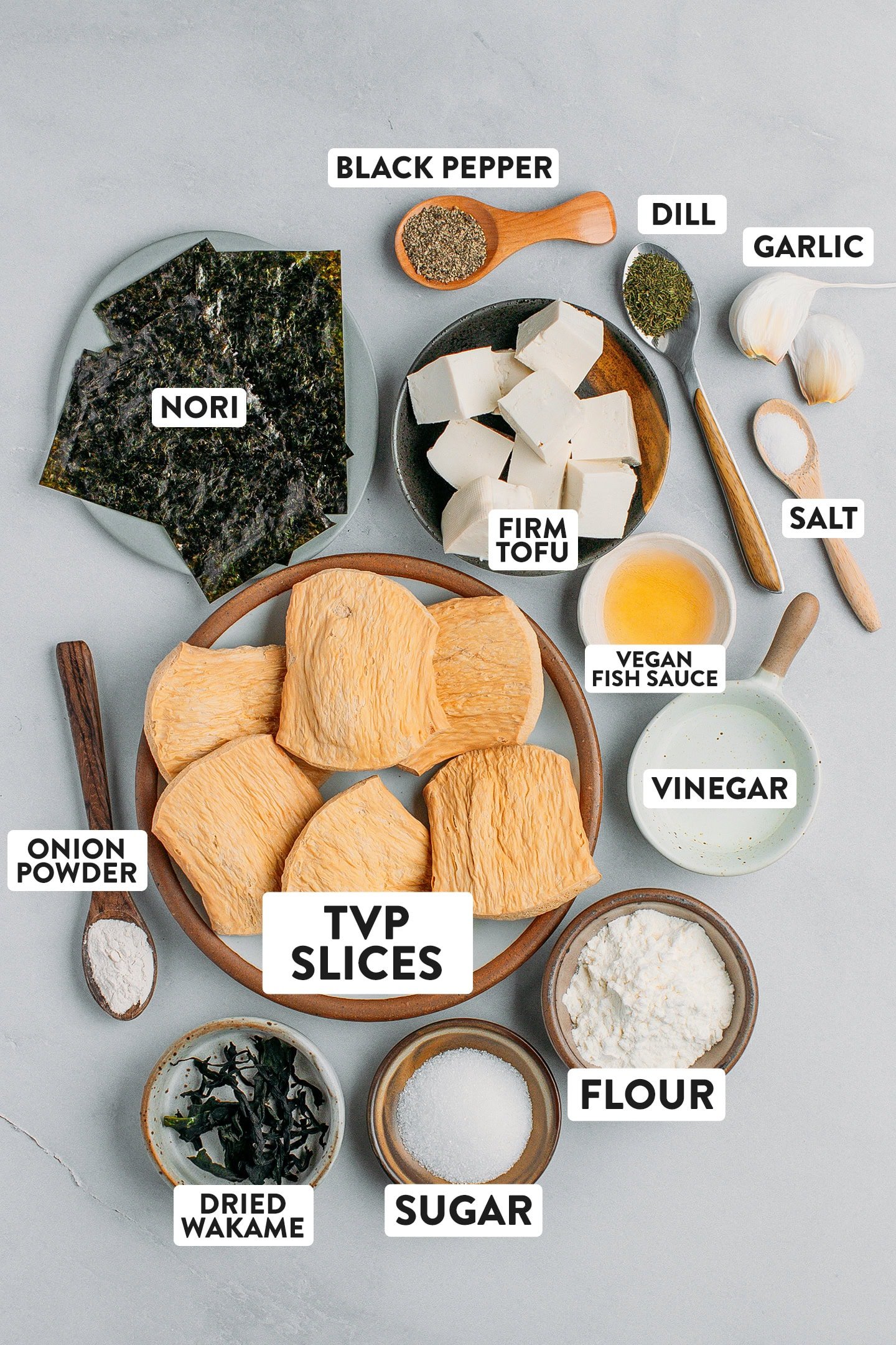 Ingredients like tvp slices, onion powder, vinegar, nori, and tofu.