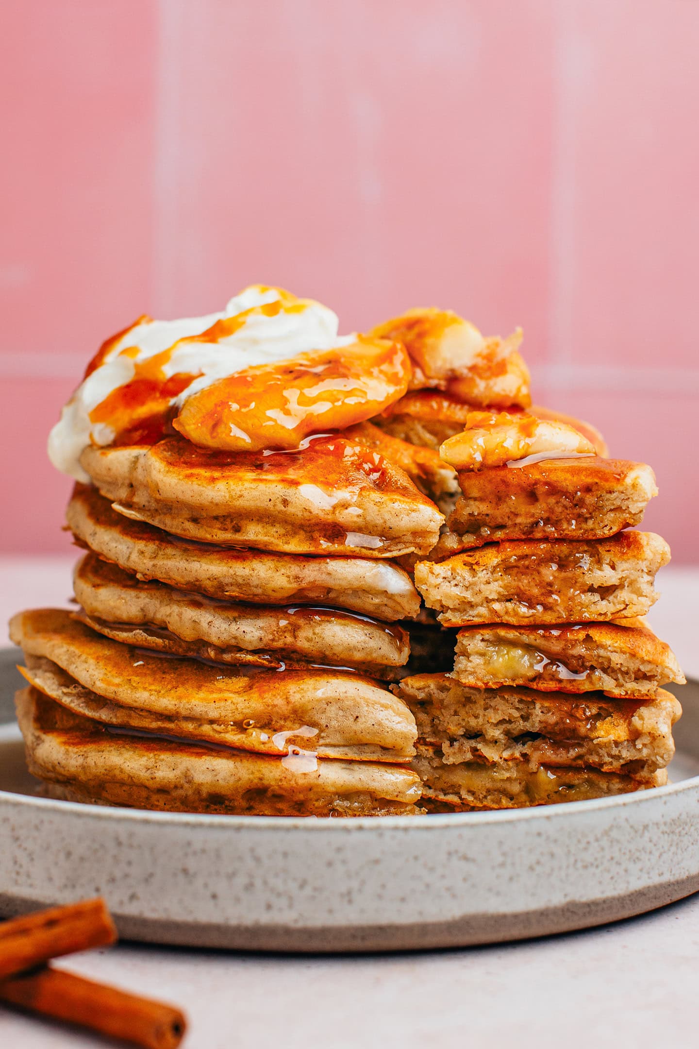 Stack of banana pancakes topped with caramelized bananas.