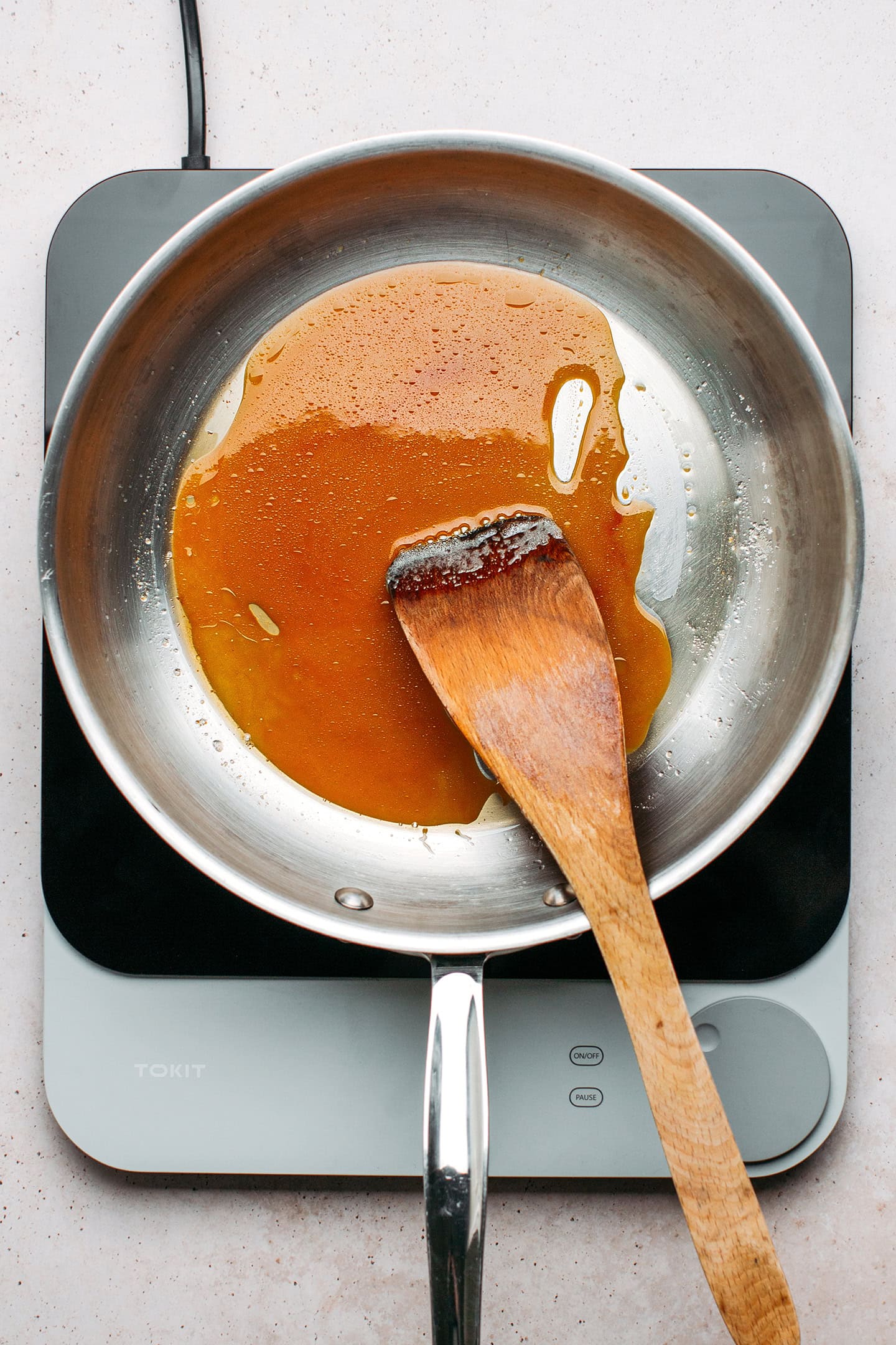 Caramel sauce in a skillet.