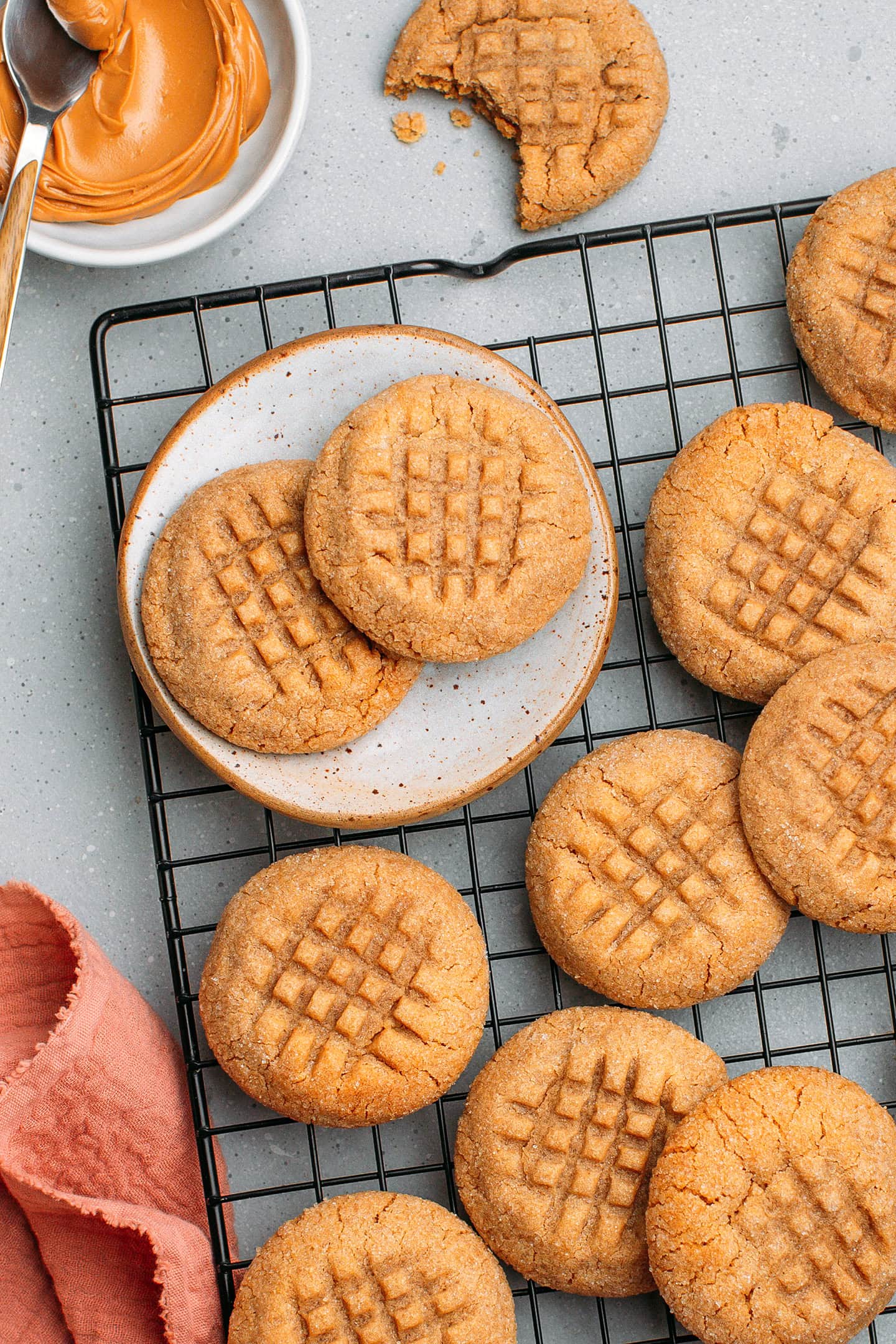 Peanut butter cookies on a cooling rack.