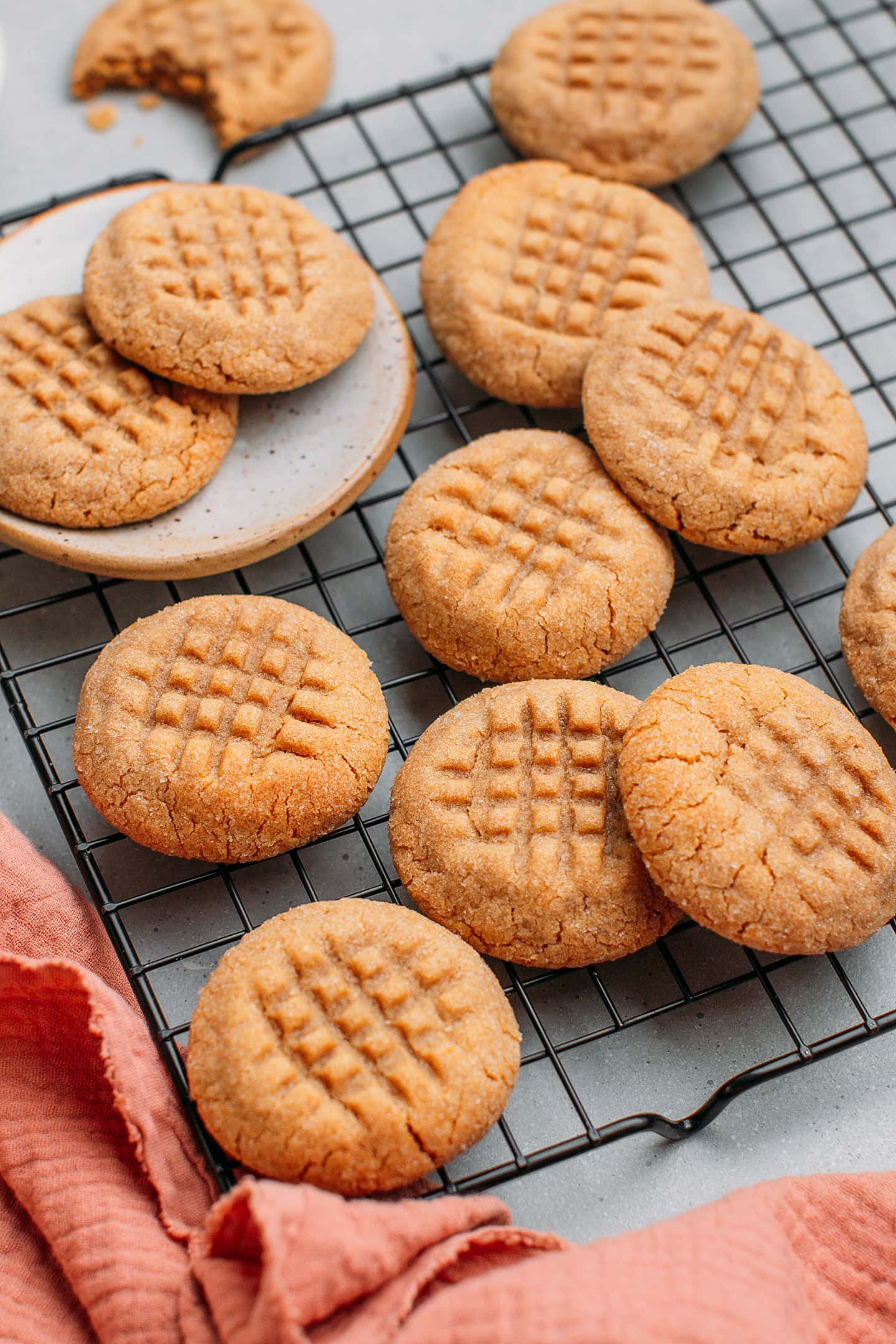Close-up of peanut butter cookies on a cooling rack.