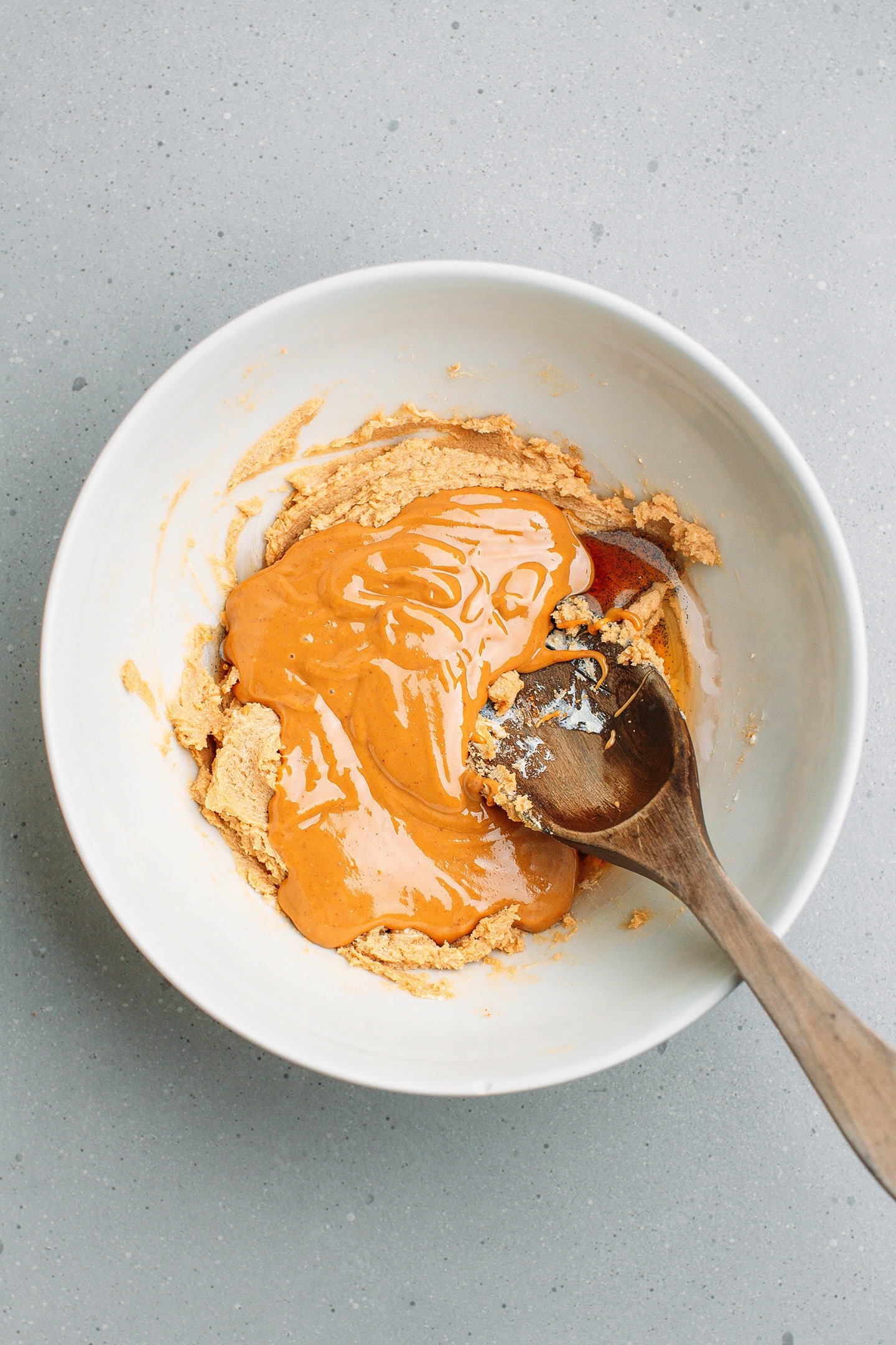 Creamed butter and peanut butter in a mixing bowl.