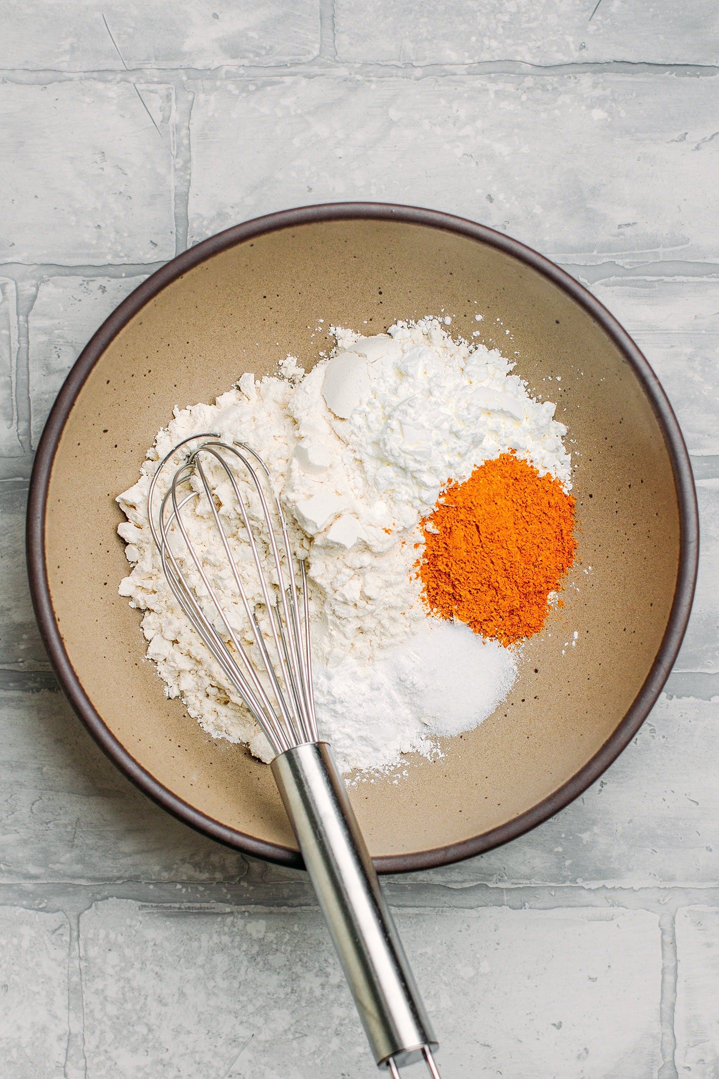 Flour, curry powder, salt, and baking powder in a bowl.