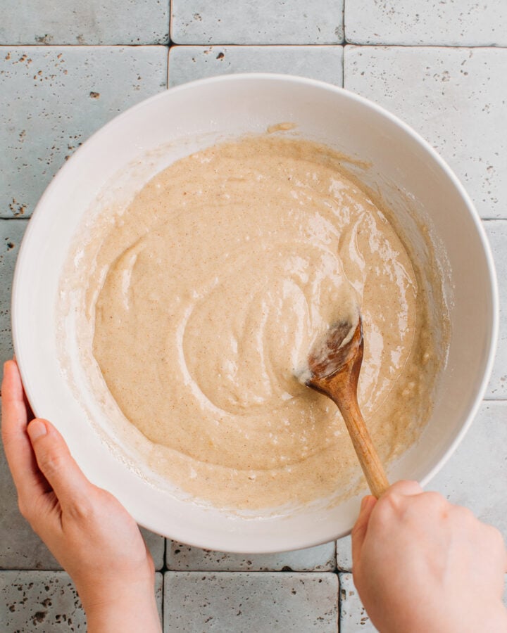 Banana muffin batter in a mixing bowl.