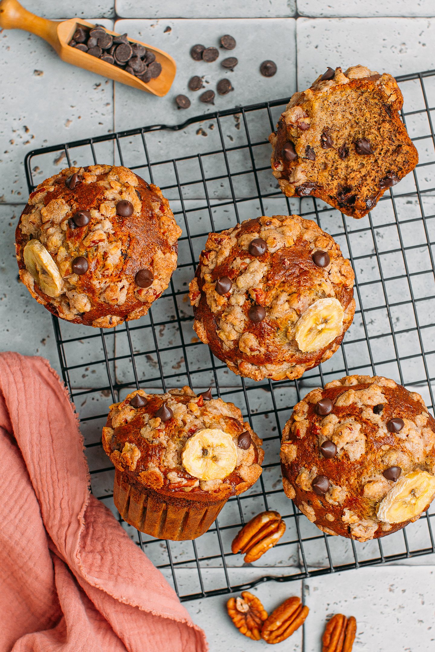 Chocolate chip banana muffins on a cooling rack.
