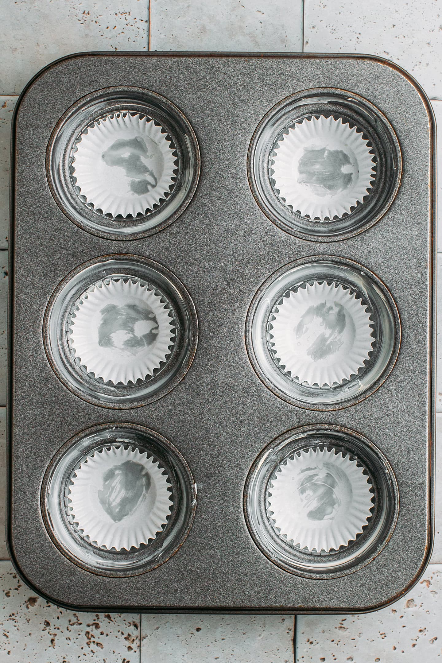 Muffin liners in a pan.