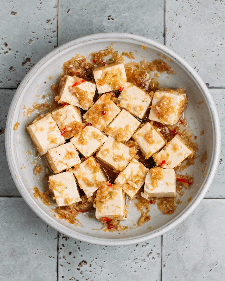 Diced tofu marinading in lemongrass, oil, soy sauce, and sugar.