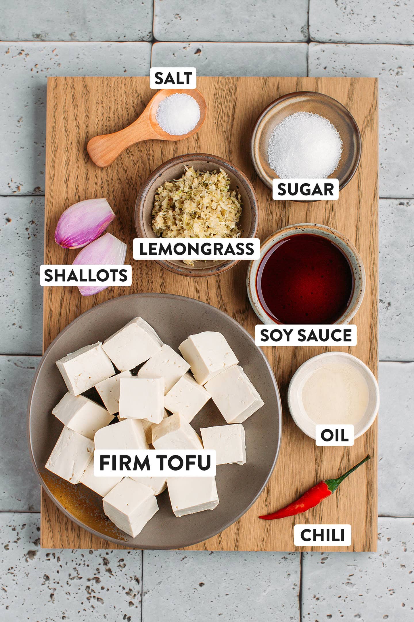 Ingredients like tofu, soy sauce, lemongrass, shallots, and sugar.