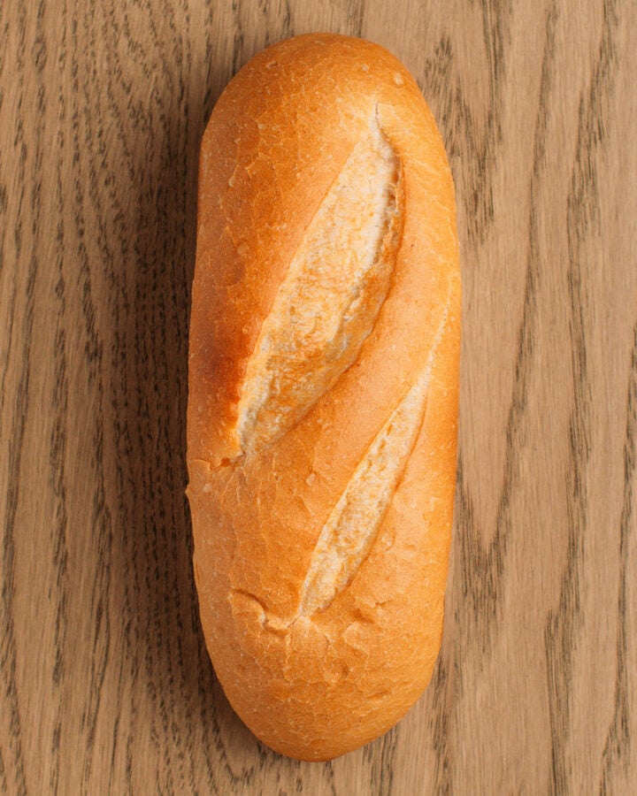 Banh mi bread on a wooden board.