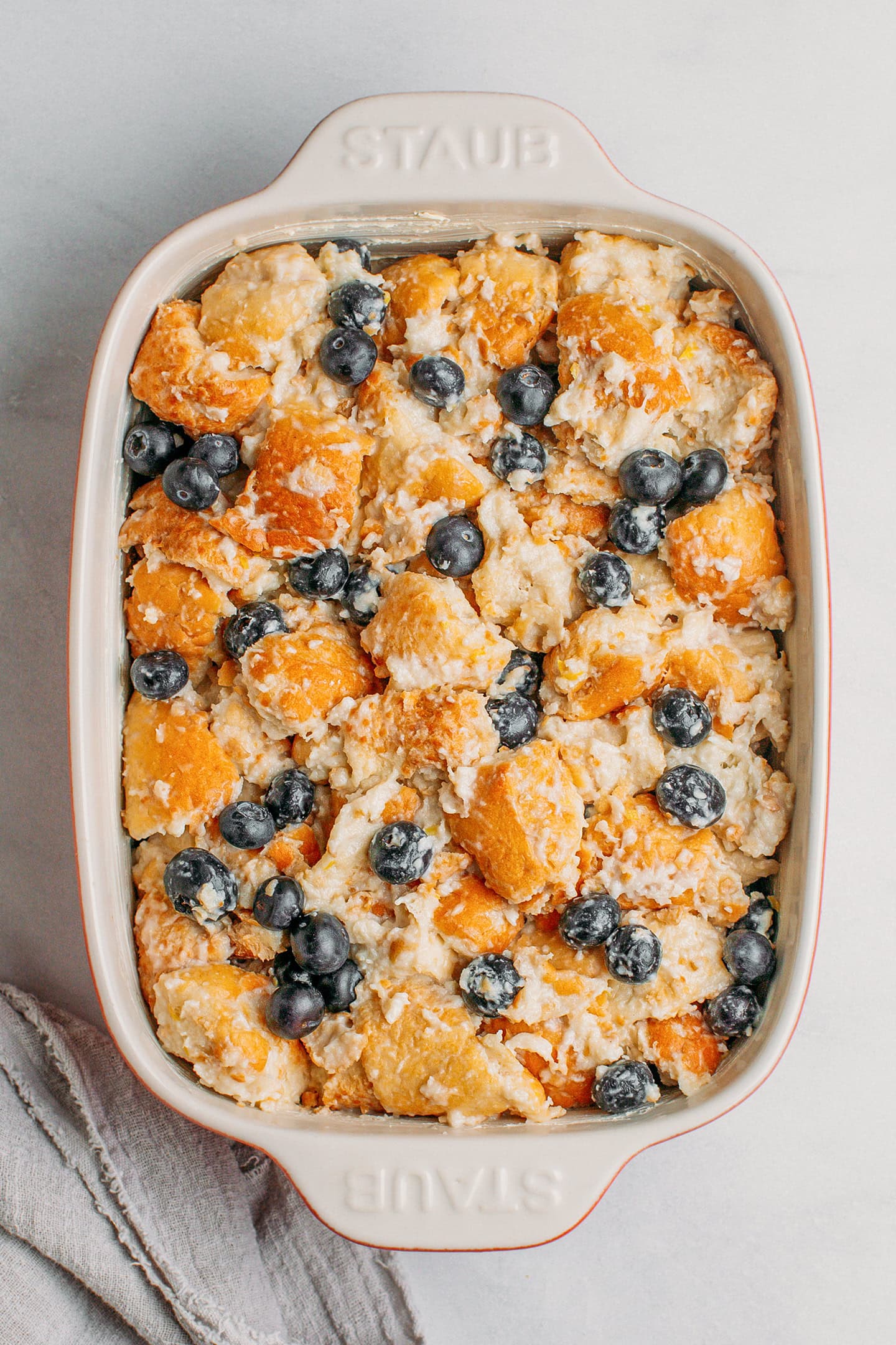 Unbaked bread pudding in a baking pan.