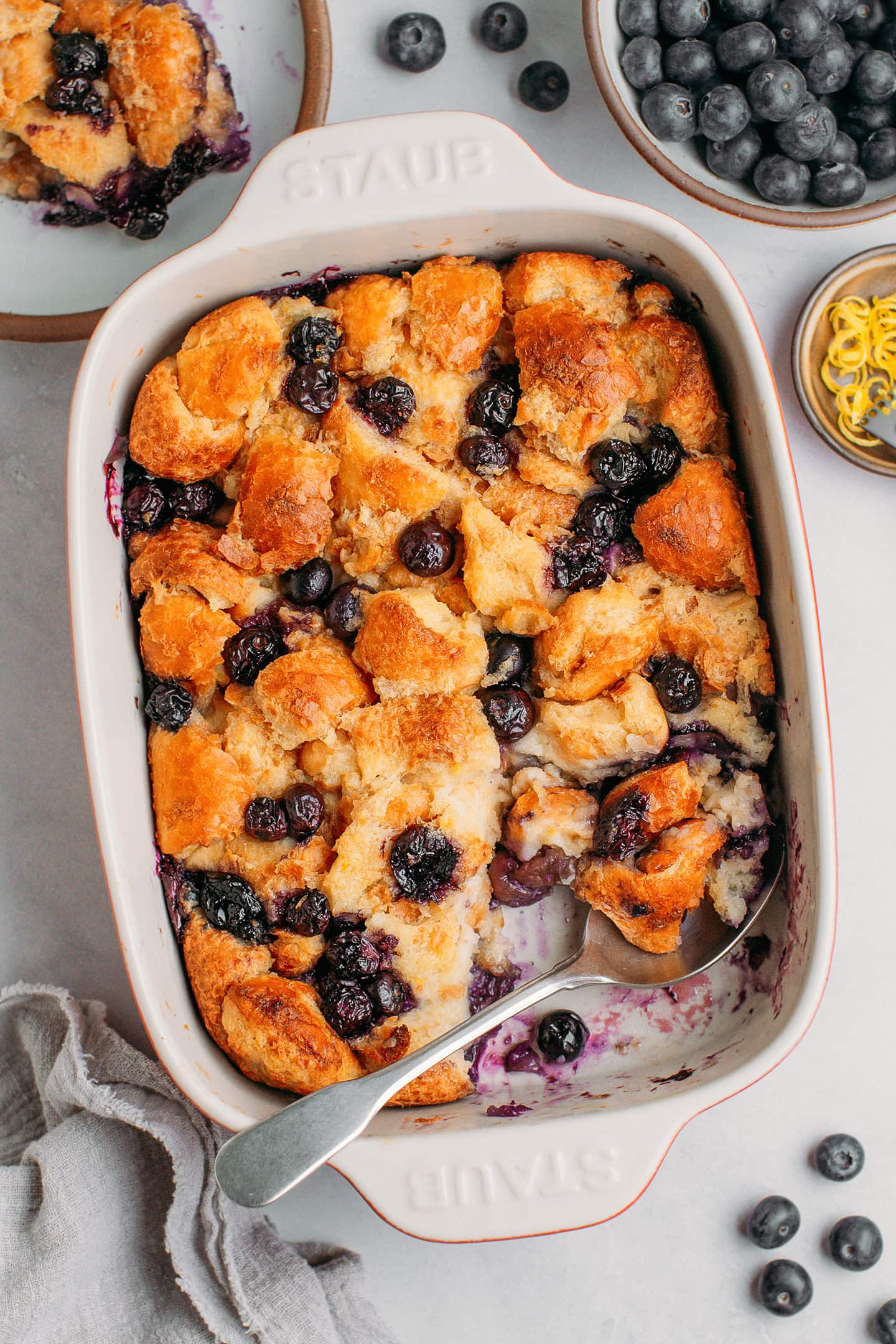 Blueberry bread pudding in a baking dish.