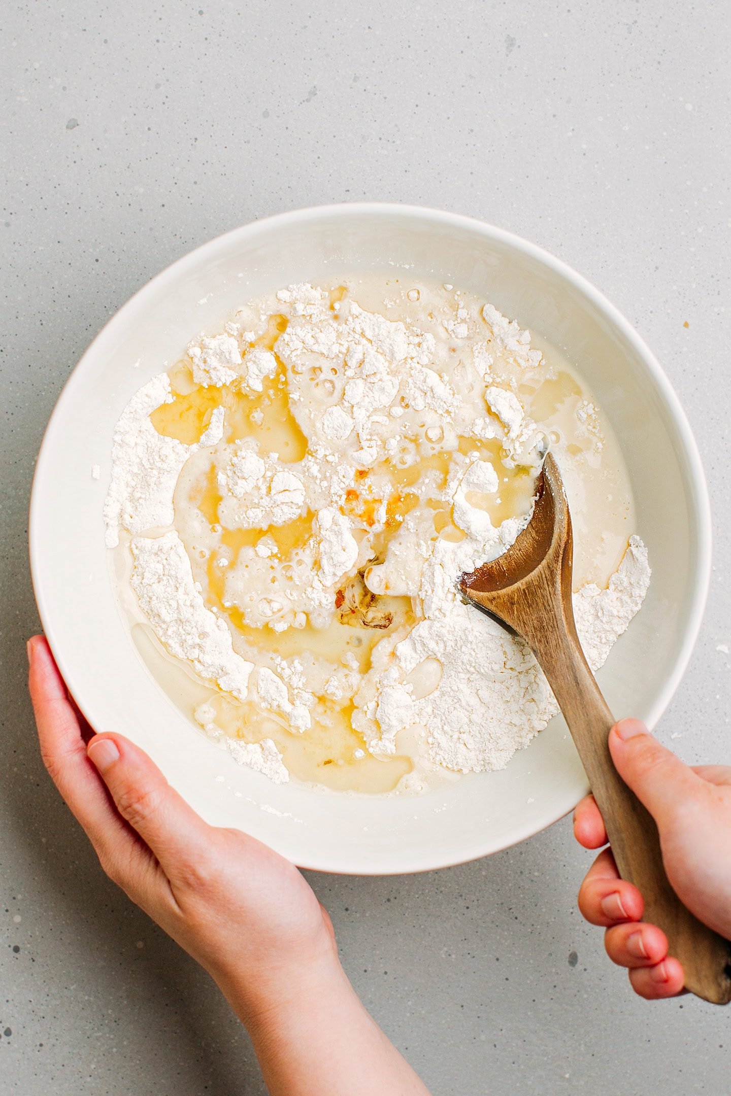Flour, sugar, oil, vanilla extract, and salt in a mixing bowl.