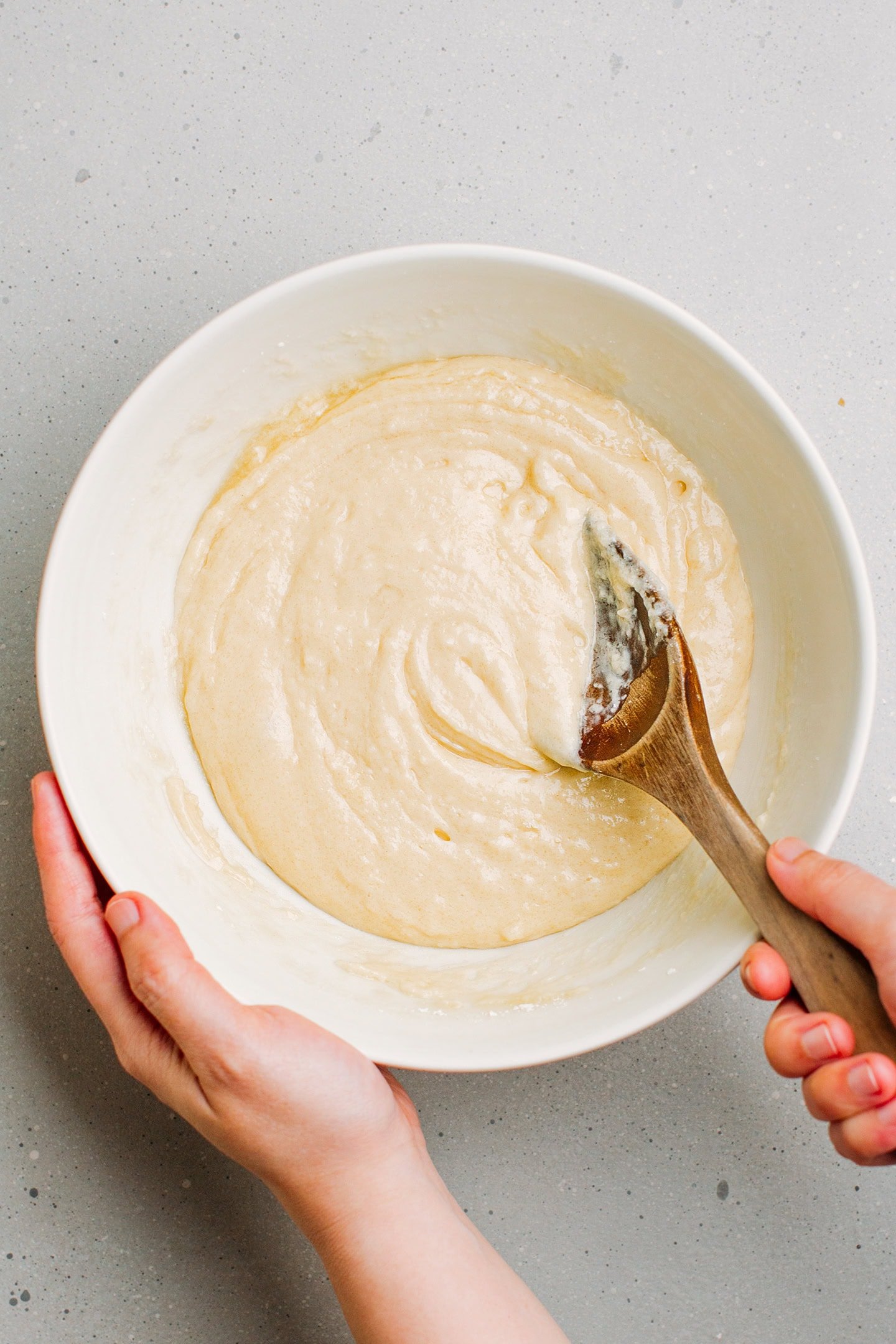 Mixing muffin batter in a bowl.