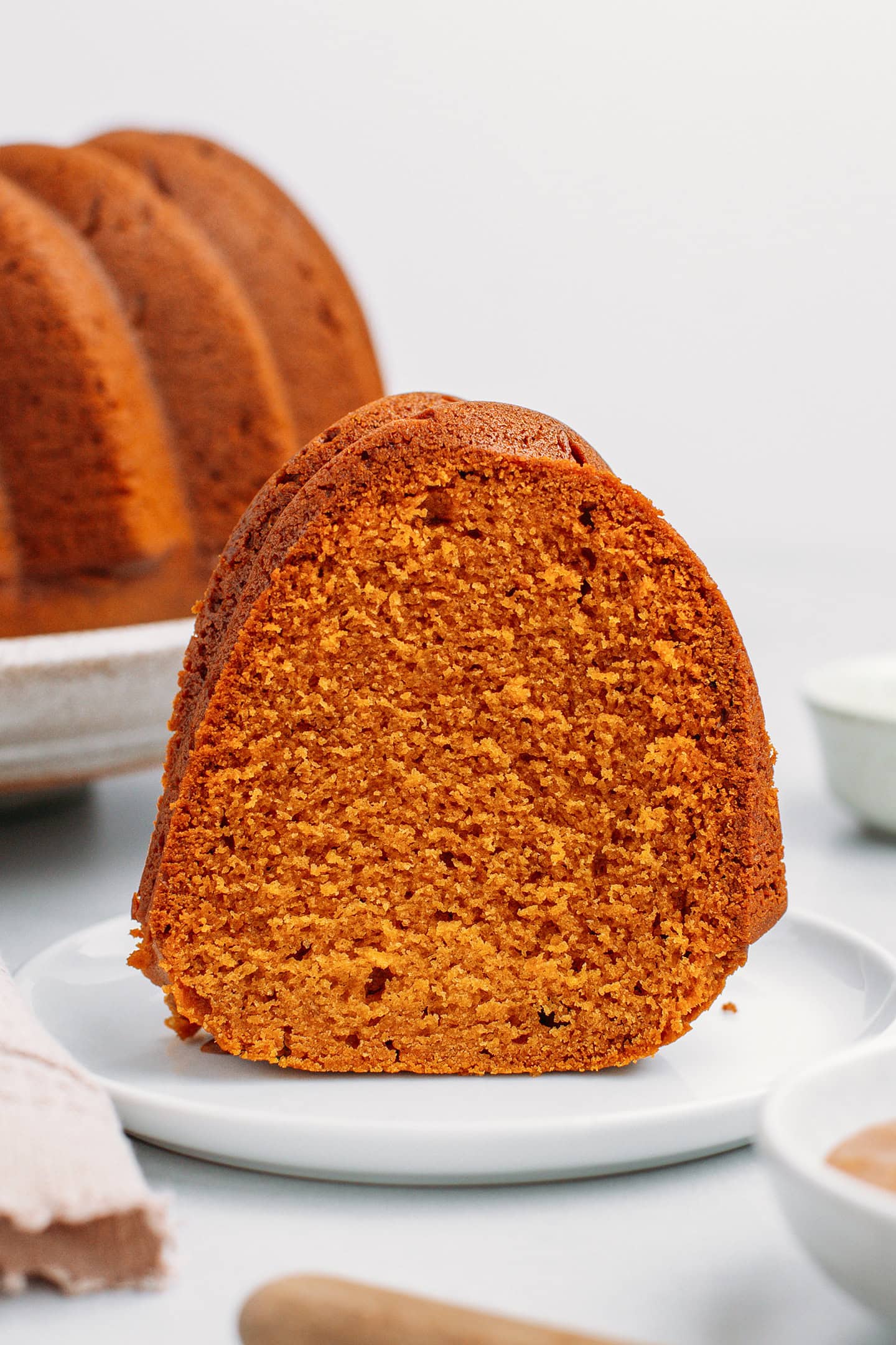 Close-up of a slice of vegan caramel pound cake.