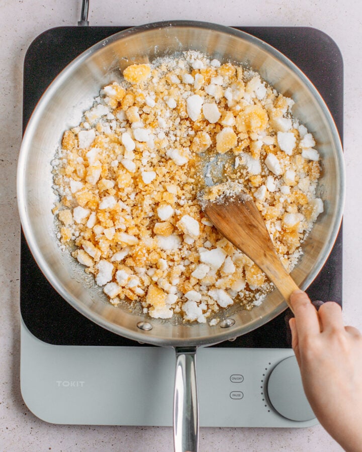 Sugar caramelizing in a large pan.