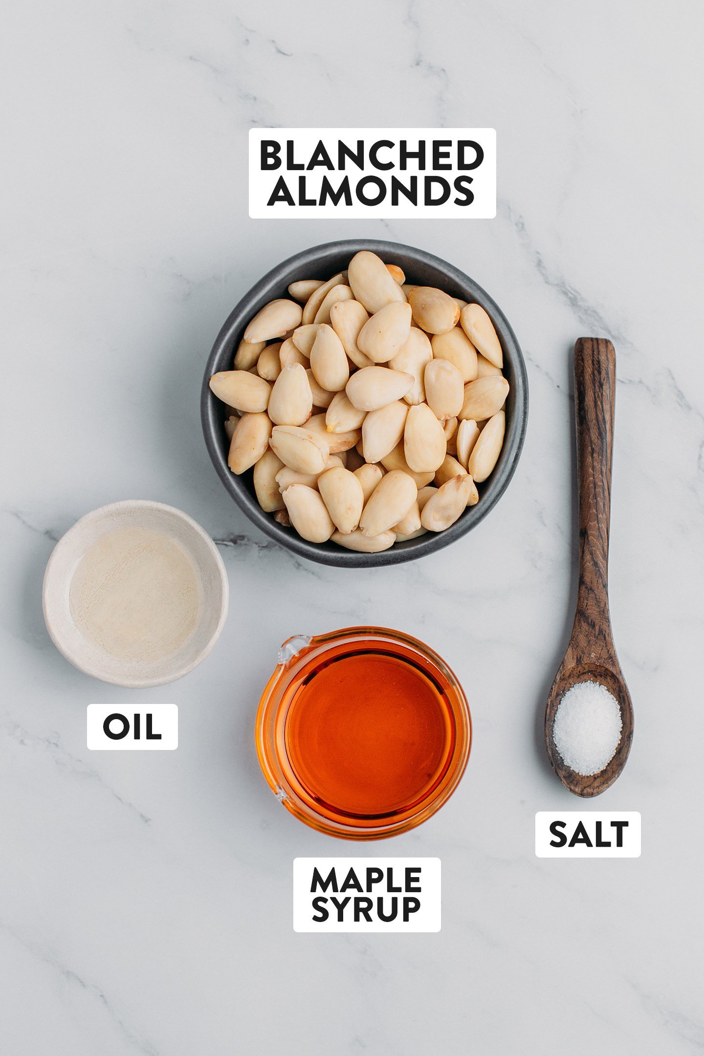 Ingredients like blanched almonds, maple syrup, salt, and oil.