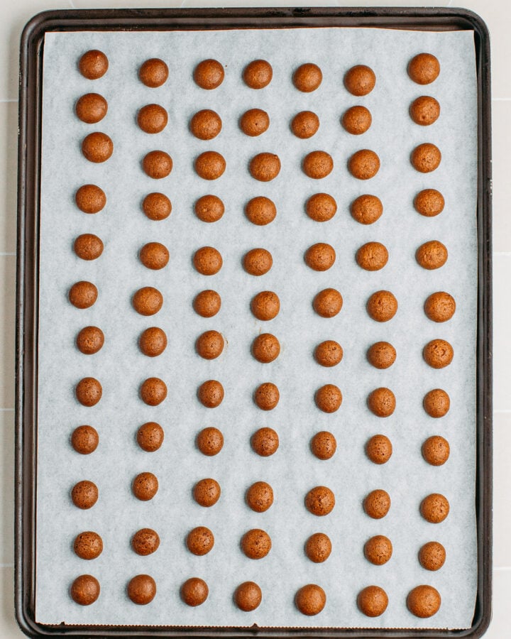Baked cinnamon cereal on a baking sheet.