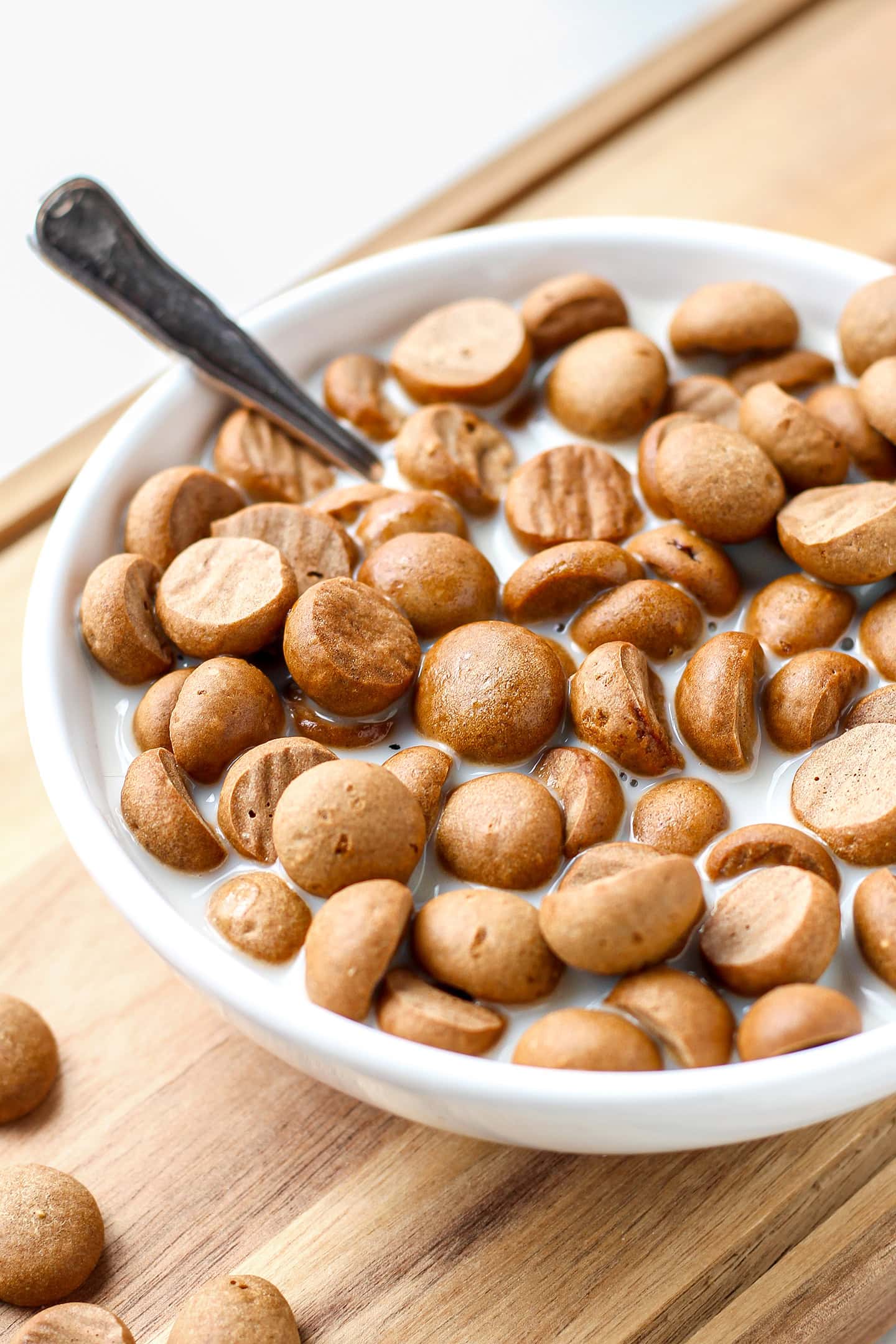 Close-up of cinnamon cereal and milk in a bowl.