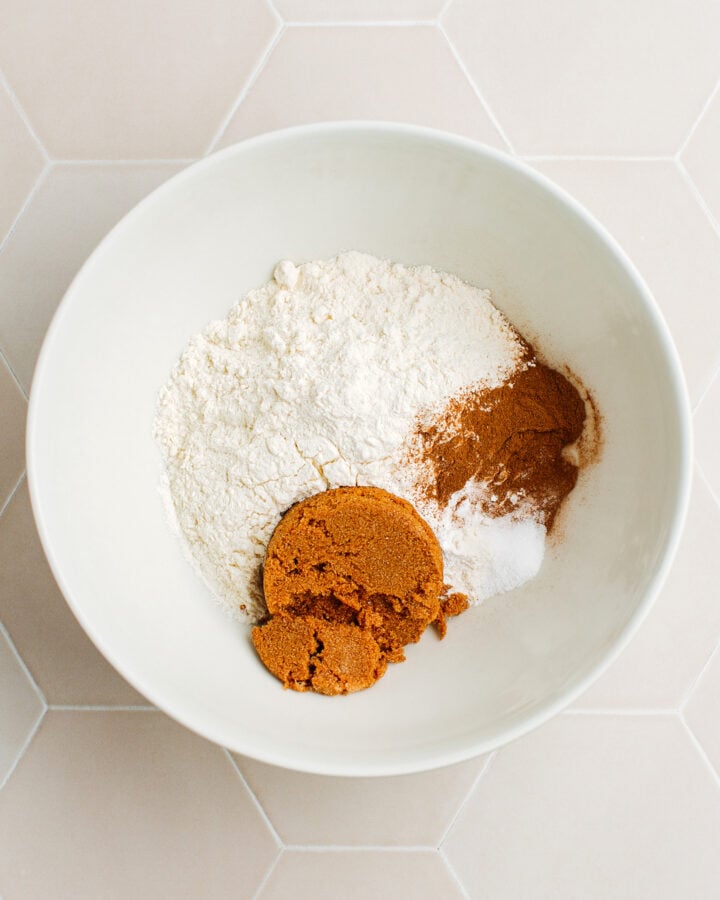 Flour, ground cinnamon, brown sugar, baking powder, and salt in a mixing bowl.