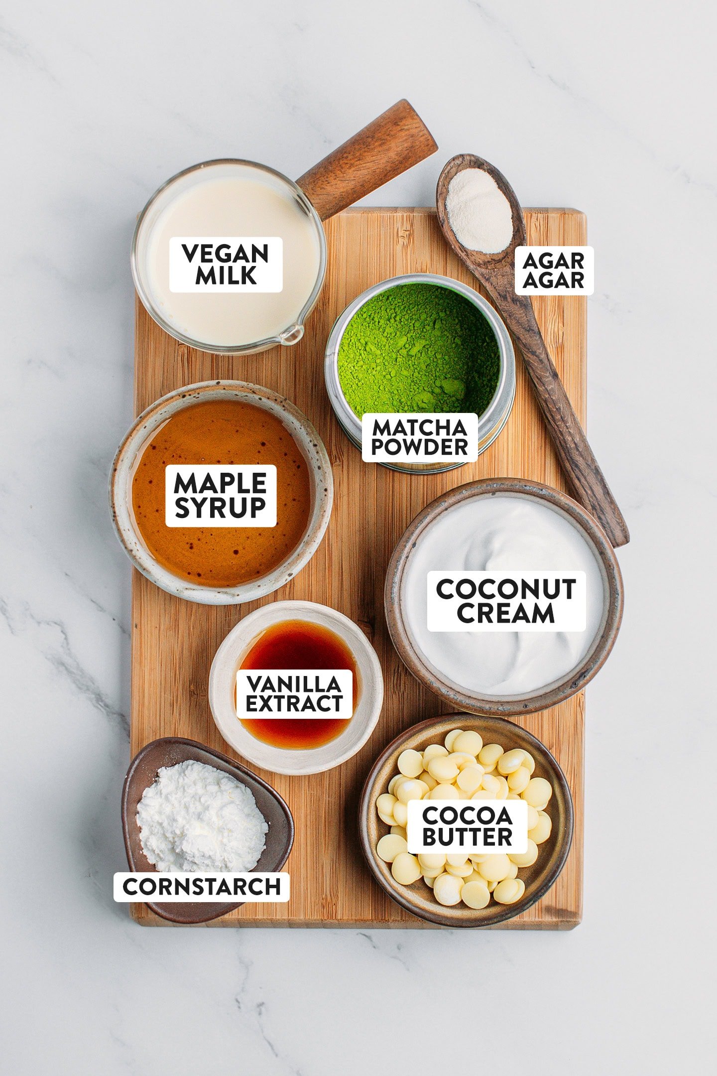 Ingredients like coconut cream, matcha powder, maple syrup, cornstarch, and milk.