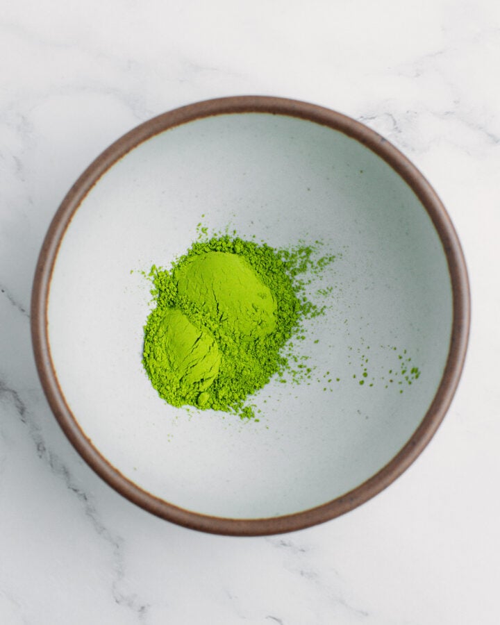 Matcha powder in a small bowl.