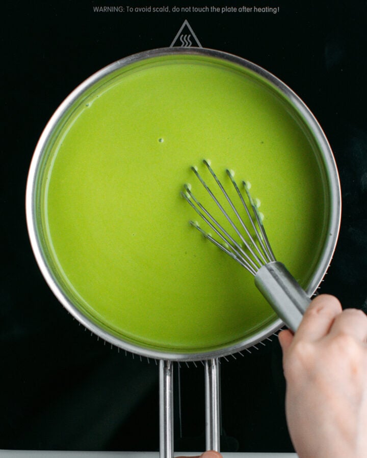 Whisking panna cotta batter in a saucepan.