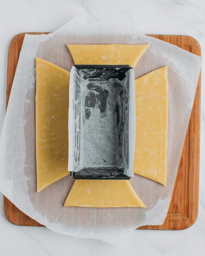 Baking pan on top of a pie crust cut to fit into the baking pan.
