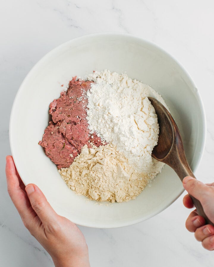 Mushroom paste, flour, and vital wheat gluten in a mixing bowl.