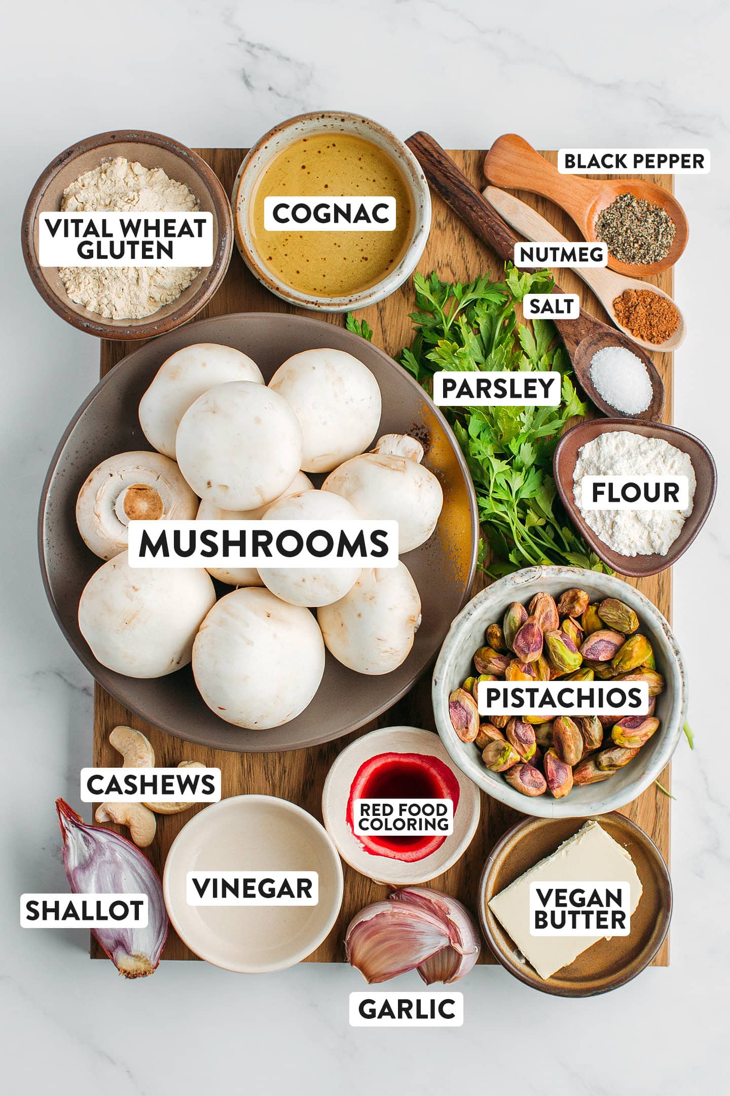 Ingredients like mushrooms, flour, pistachios, vital wheat gluten, vegan butter, and garlic.