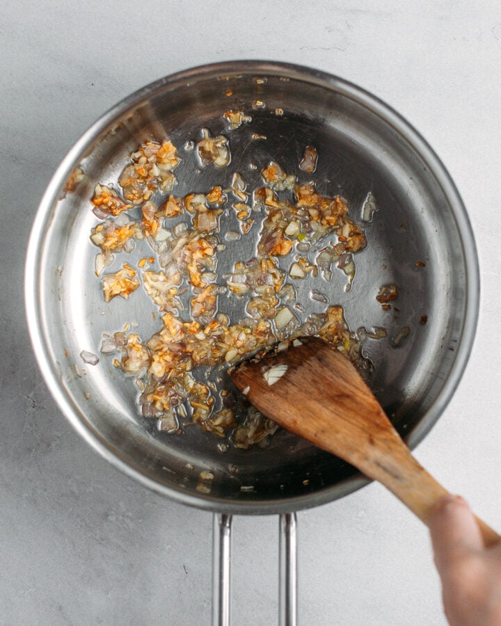 Sautéed garlic and shallot in a saucepan.