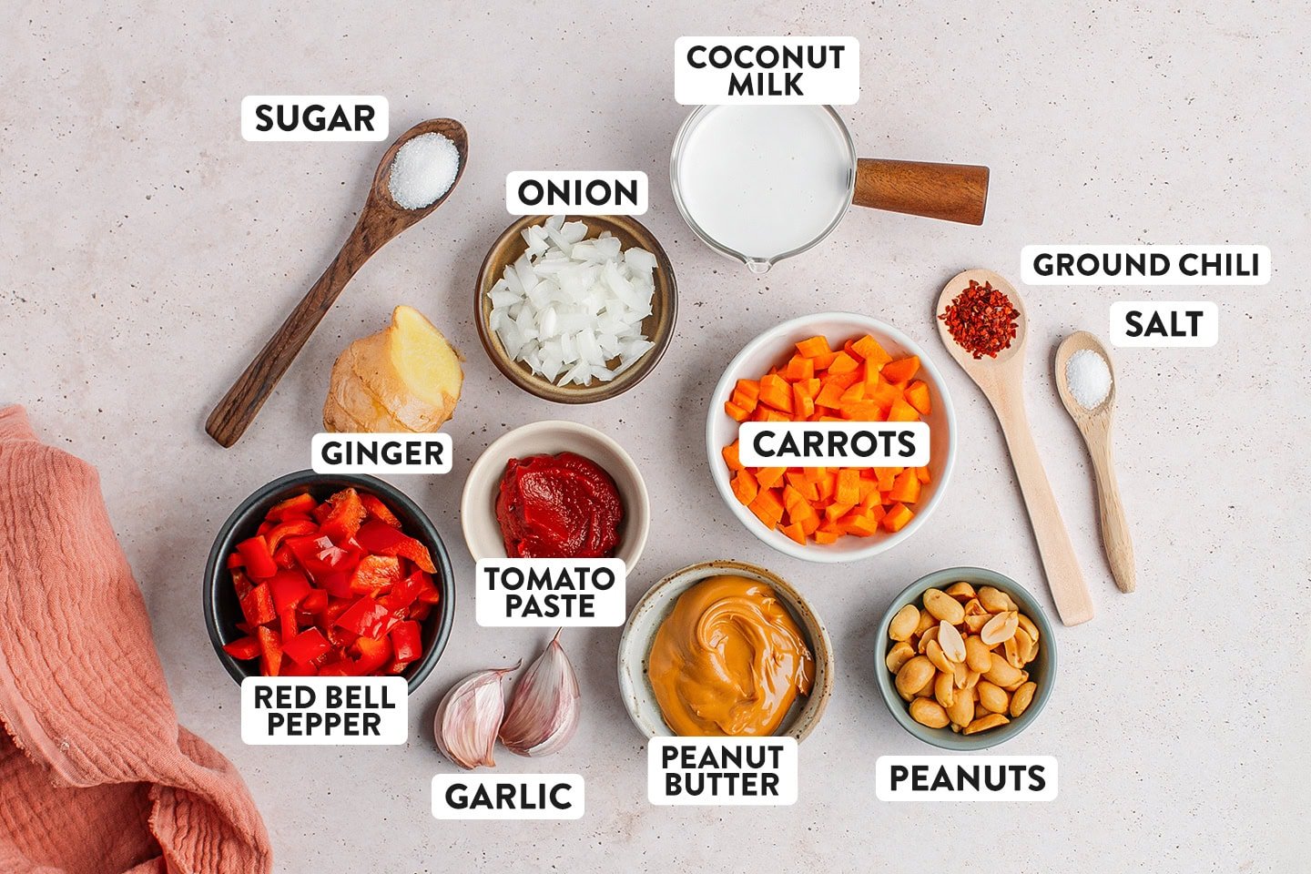 Ingredients like carrots, coconut milk, garlic, onion, and peanut butter.