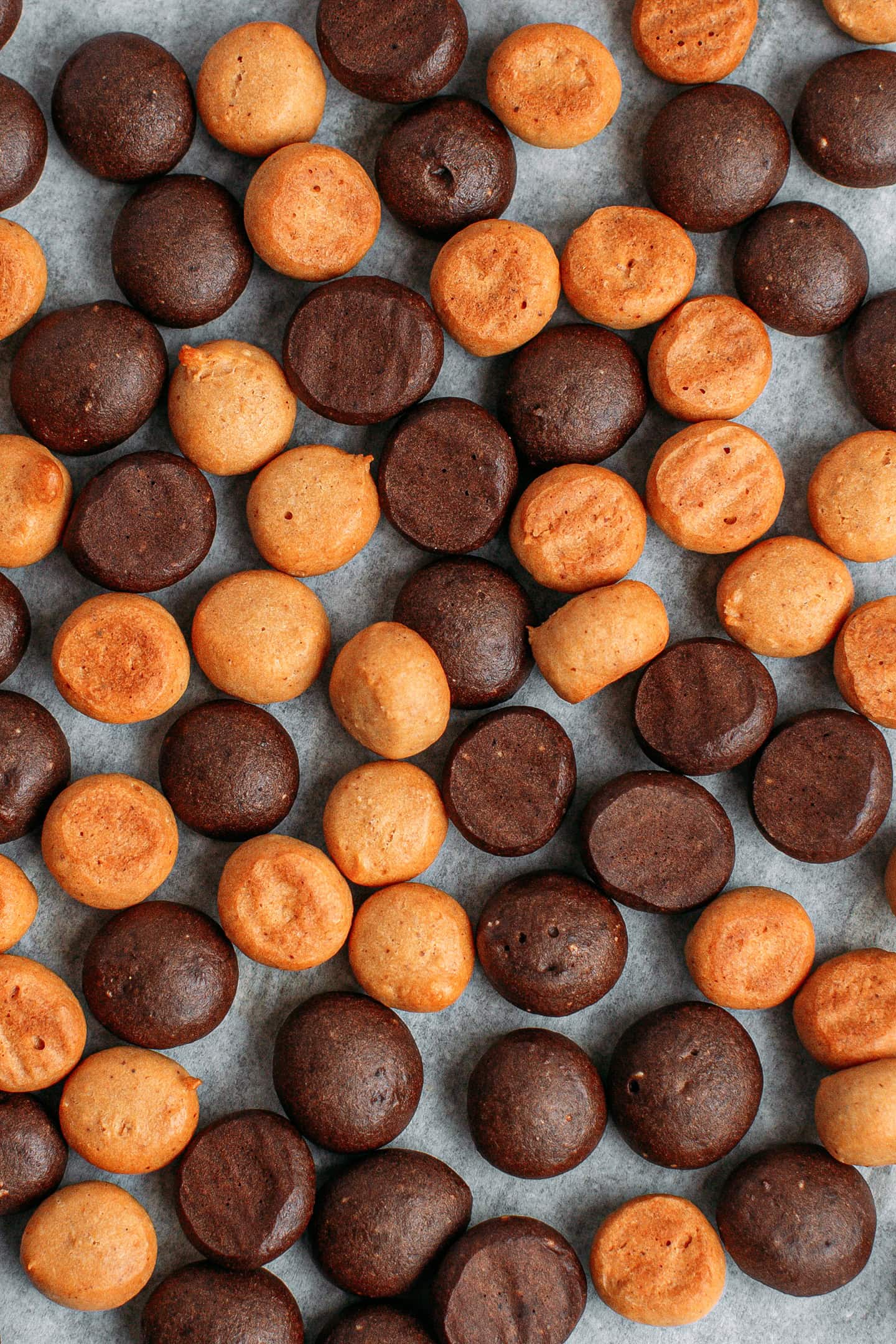 Baked chocolate and peanut butter cereal on a baking sheet.