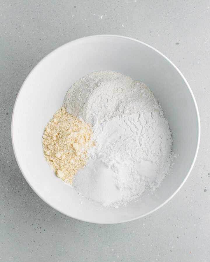 Buckwheat flour, almond flour, rice flour, and baking powder in a mixing bowl.