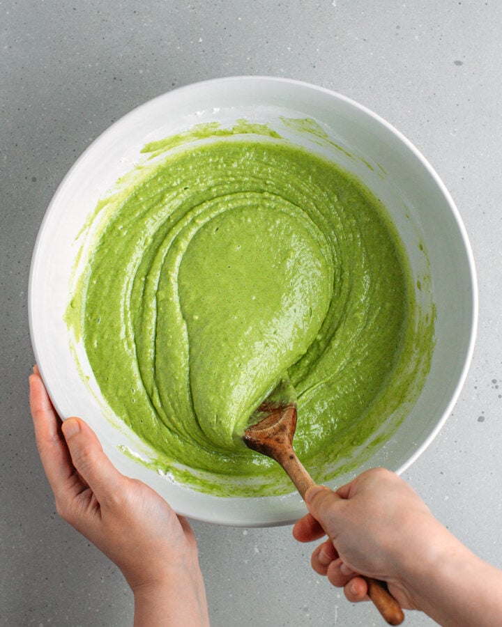 Mixing pandan cake batter in a mixing bowl.