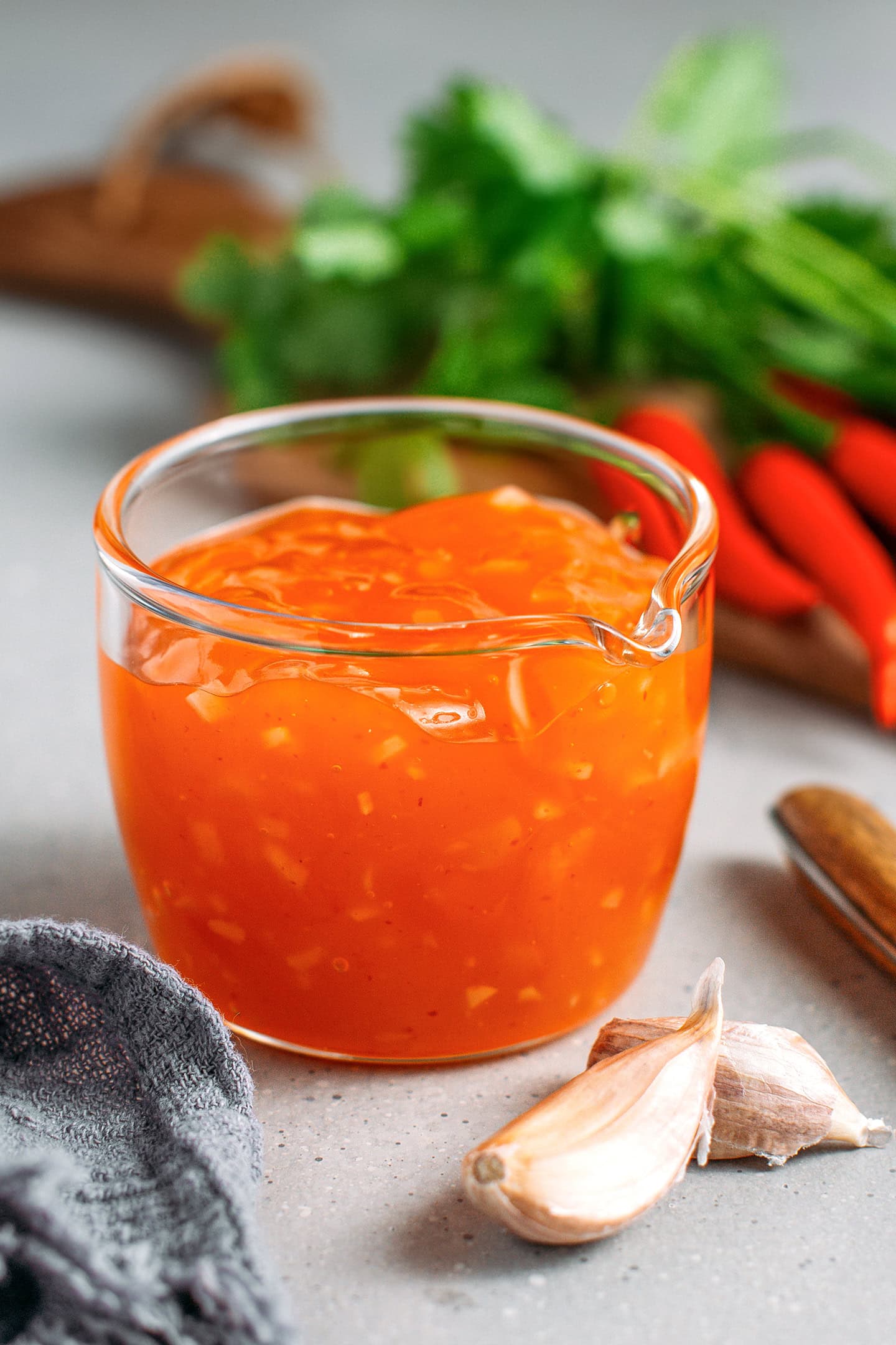 Sweet and sour chili sauce in a small glass cup.