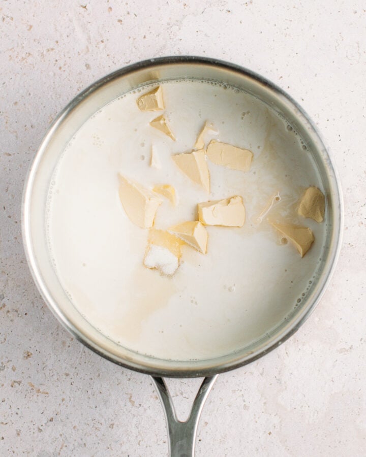 Plant-based milk, sugar, and butter in a saucepan.