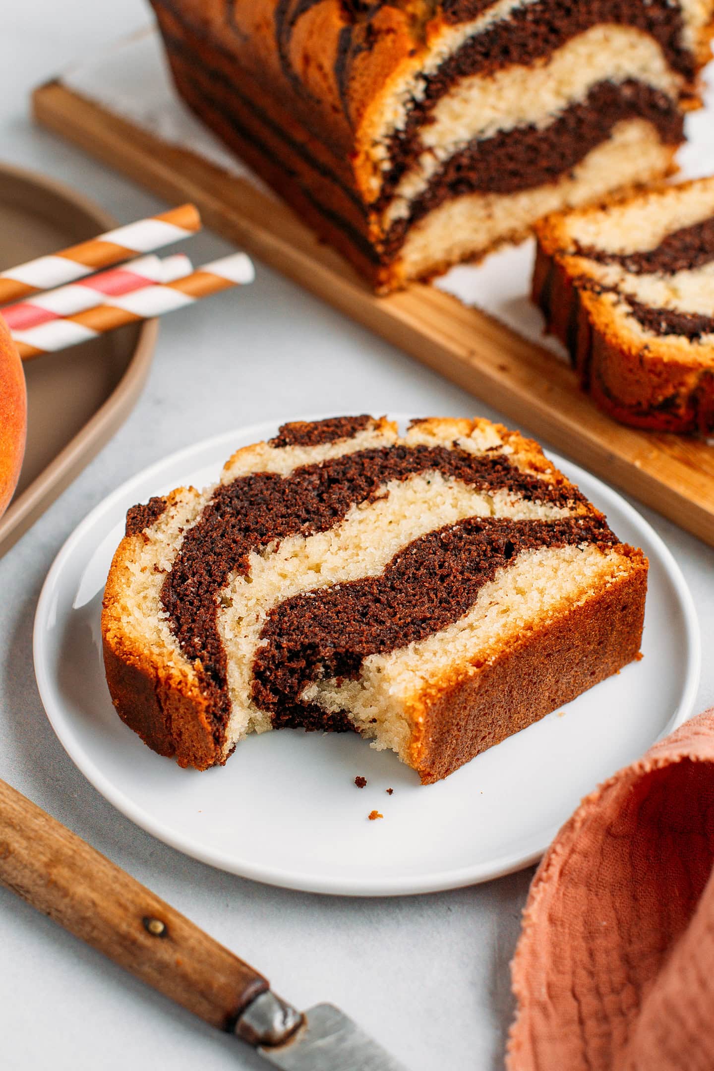 Slice of marble cake on a small white plate.
