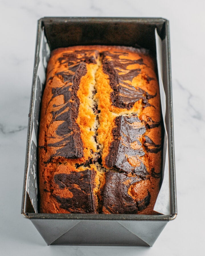 Baked marble cake in a loaf pan.