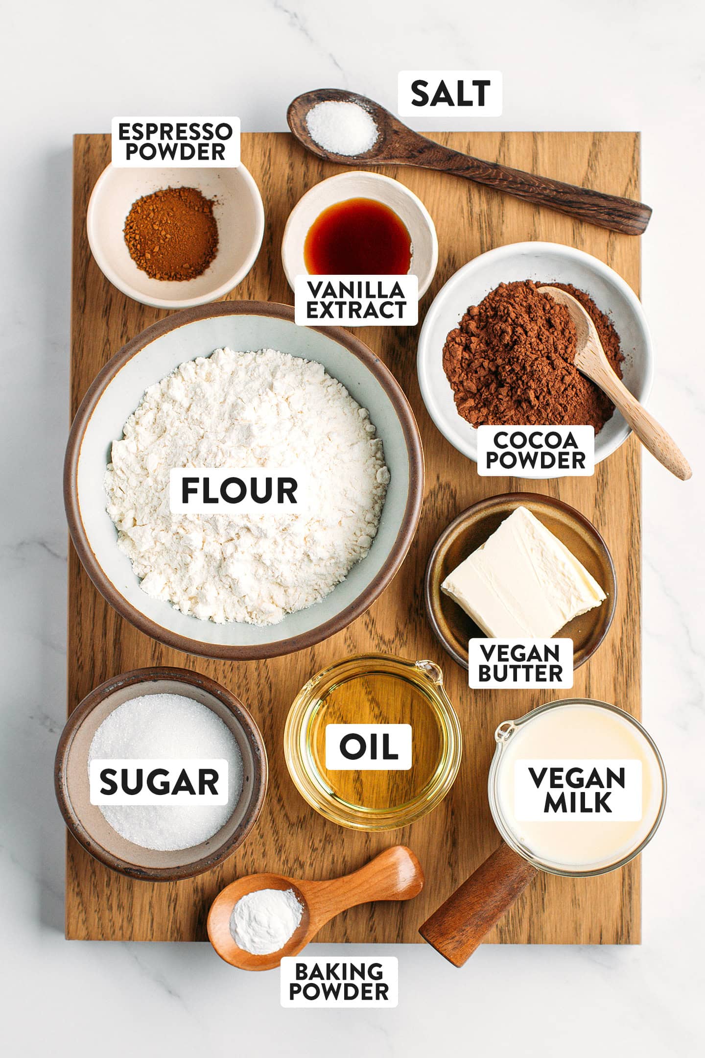 Ingredients like flour, cocoa powder, sugar, oil, and butter.