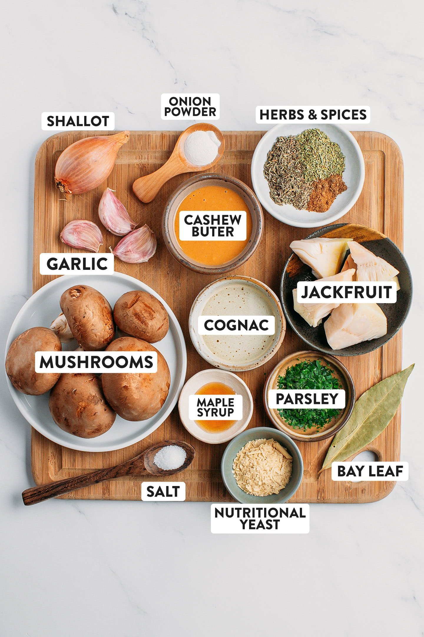 Ingredients like mushrooms, garlic, shallot, jackfruit, and cashew butter.