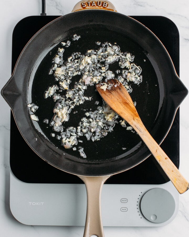 Sautéed garlic and shallot in a skillet.