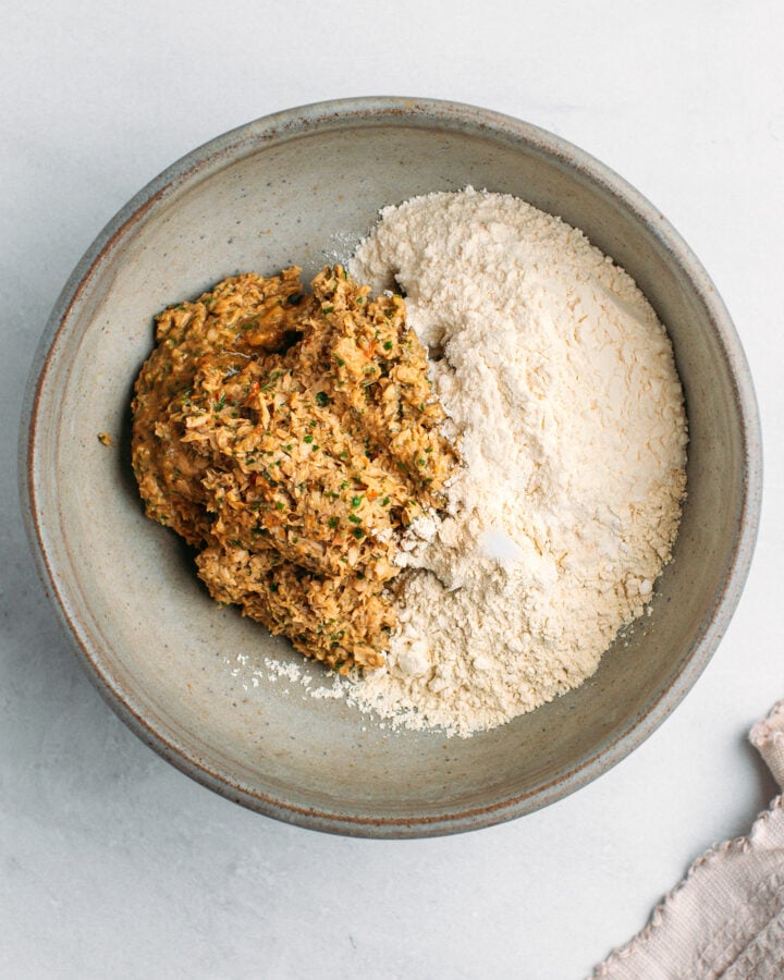 TVP paste with vital wheat gluten and flour in a mixing bowl.
