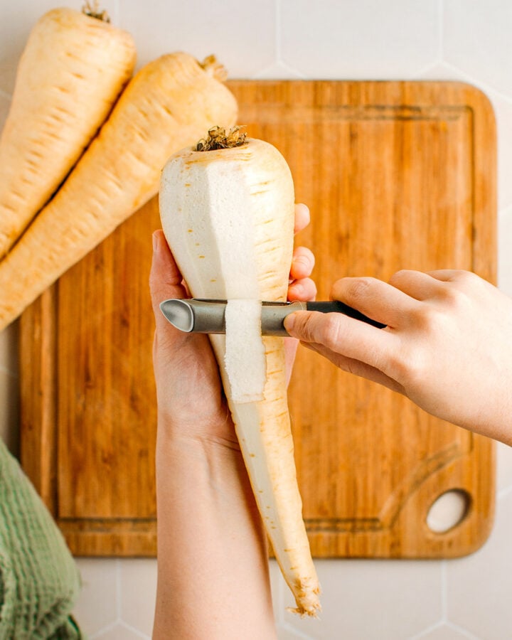 Peeling a parsnip.
