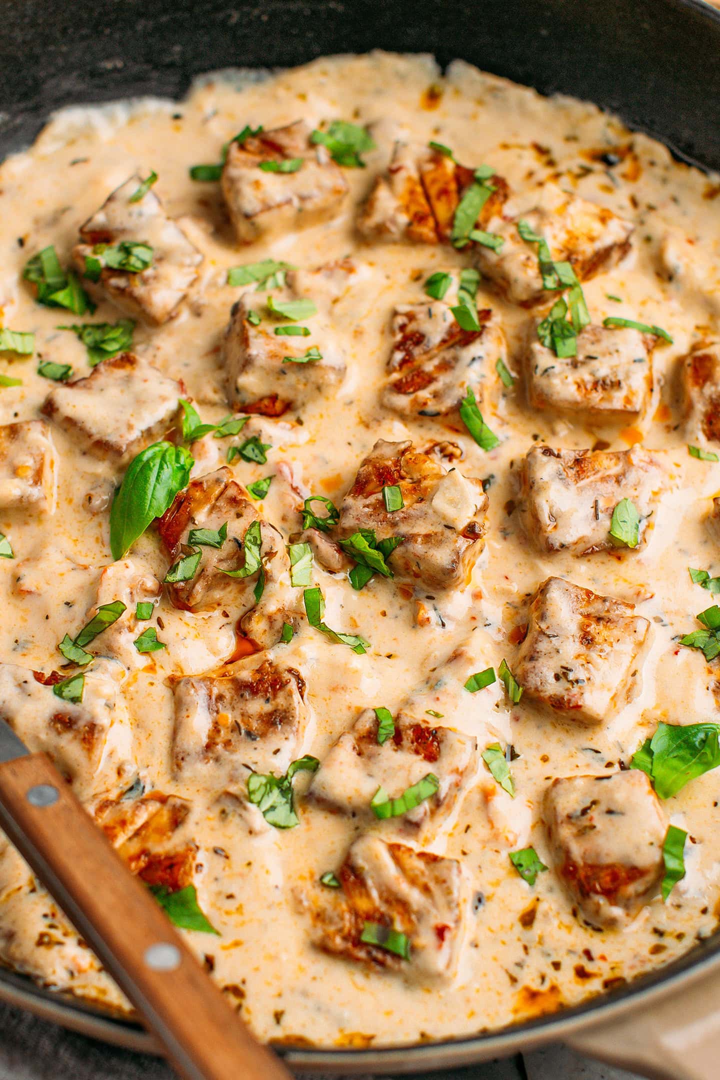 Close-up of baked tofu in a creamy Marry Me sauce.