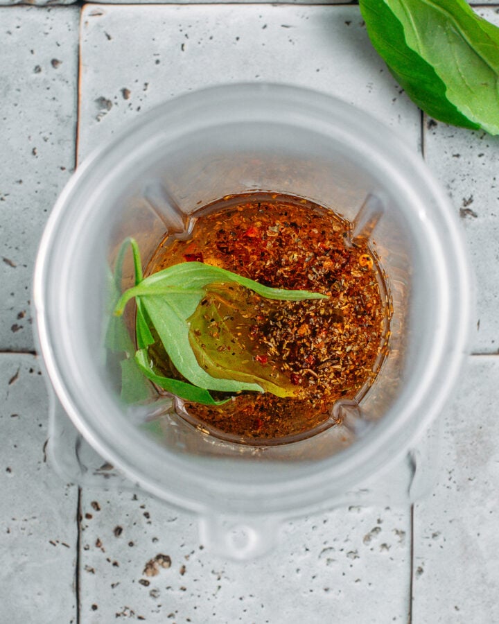 Oil, sun-dried tomato, Italian seasoning, and garlic in a blender.