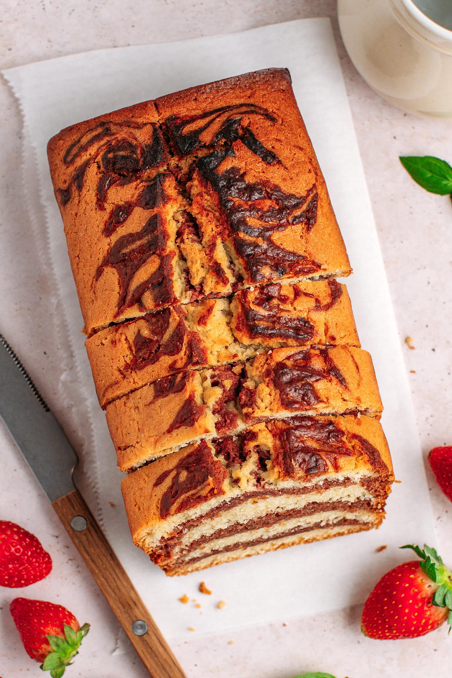 Top view of a sliced strawberry marble cake.